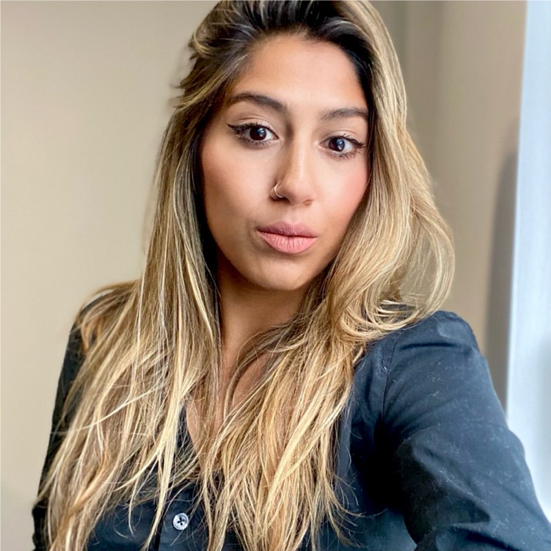 Photo of Samar, blue top with bold to black layered hair